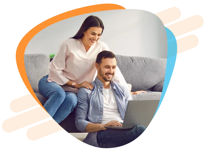 Couple reviewing their loan application together on a laptop